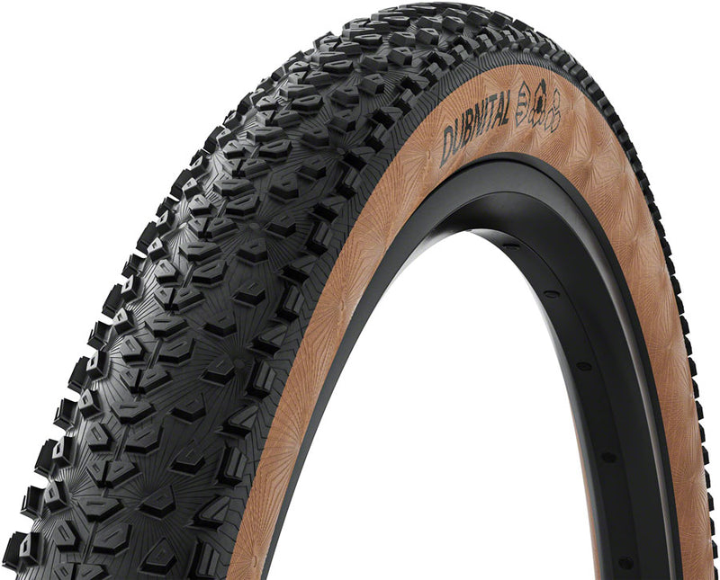 Load image into Gallery viewer, Continental Dubnital Tire - 29 x 2.40 Tubeless Folding BLK/Transparent Grip Race Casing E25

